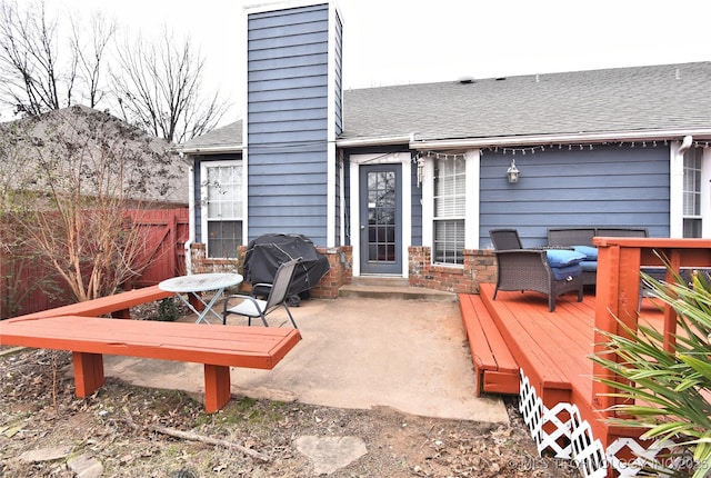 deck with area for grilling, an outdoor living space, and a patio area