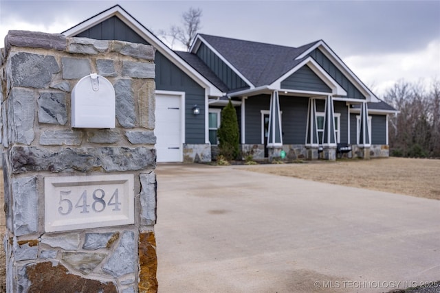 view of front of home featuring a garage and covered porch