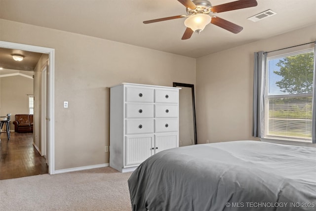 carpeted bedroom featuring ceiling fan