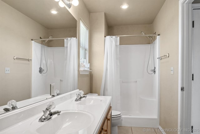 bathroom with vanity, a shower with curtain, and tile patterned floors