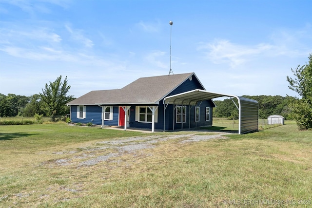 single story home featuring a storage shed, a front yard, and a carport