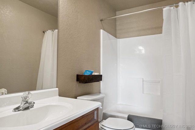 full bathroom with vanity, shower / bath combination with curtain, and toilet