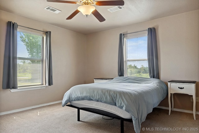 carpeted bedroom with ceiling fan