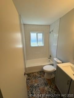 full bathroom with tiled shower / bath combo, vanity, and toilet