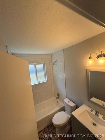 full bathroom featuring vanity, tiled shower / bath combo, a textured ceiling, and toilet