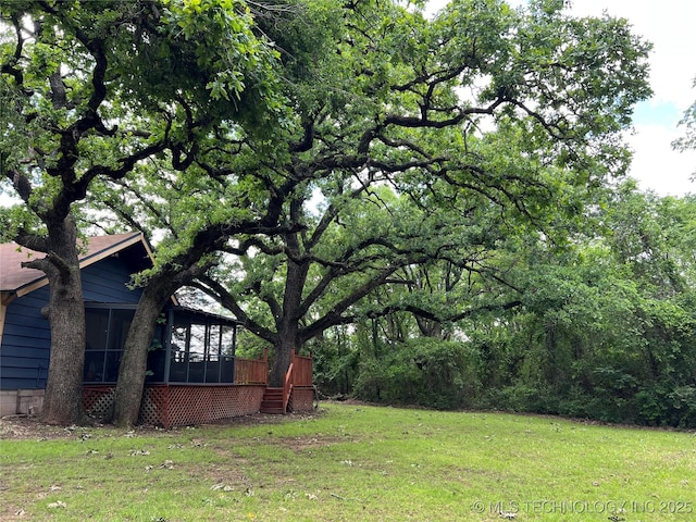 4 Canadian Dr, Burneyville, OK 73430 - view of green lawn featuring a sunroom