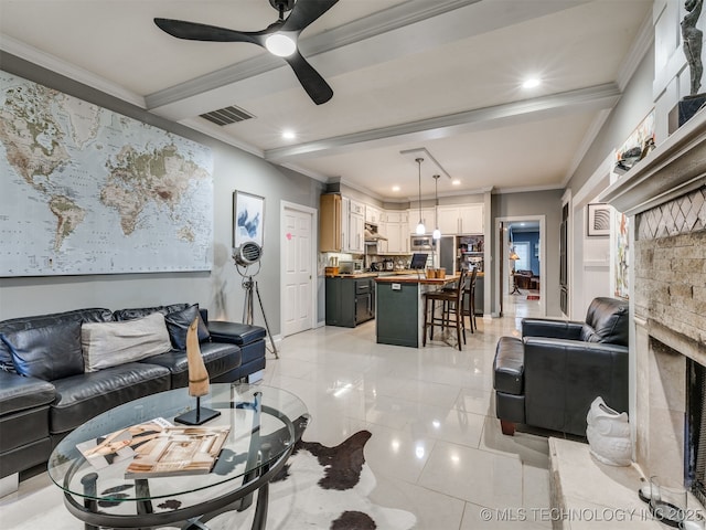 8918 S Lakewood Ave, Tulsa, OK 74137 - living area with ornamental molding, ceiling fan, recessed lighting, light tile patterned flooring, and beamed ceiling