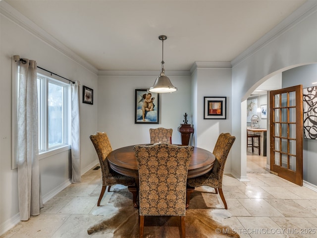 8918 S Lakewood Ave, Tulsa, OK 74137 - dining space with arched walkways and ornamental molding