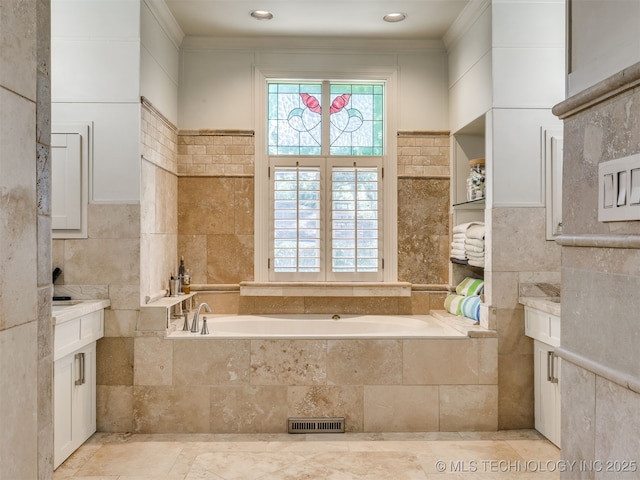 8918 S Lakewood Ave, Tulsa, OK 74137 - bathroom featuring tile walls, a bath, vanity, and crown molding