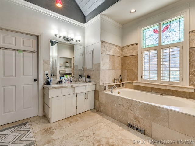 8918 S Lakewood Ave, Tulsa, OK 74137 - bathroom featuring vanity, a bath, tile walls, lofted ceiling, and ornamental molding