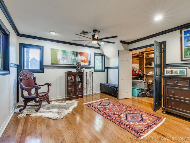 8918 S Lakewood Ave, Tulsa, OK 74137 - living area with a ceiling fan, ornamental molding, and wood finished floors