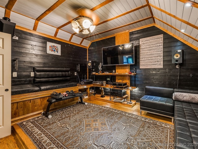 8918 S Lakewood Ave, Tulsa, OK 74137 - living room featuring lofted ceiling, wood-type flooring, wooden walls, and ceiling fan