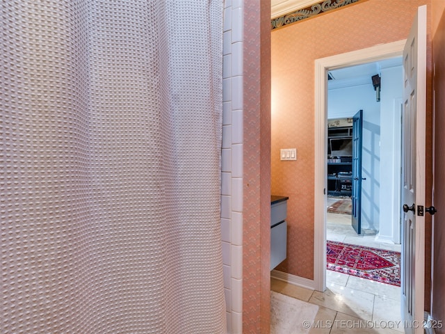 8918 S Lakewood Ave, Tulsa, OK 74137 - bathroom with tile patterned floors, a shower with shower curtain, vanity, and wallpapered walls