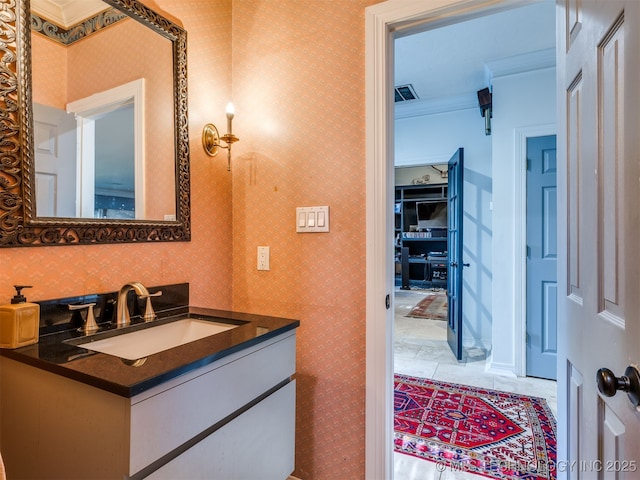 8918 S Lakewood Ave, Tulsa, OK 74137 - bathroom featuring vanity, wallpapered walls, and ornamental molding