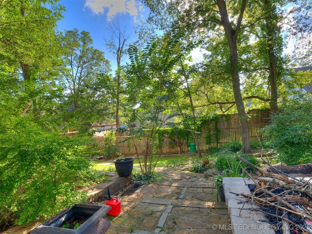8918 S Lakewood Ave, Tulsa, OK 74137 - fenced backyard featuring a patio area