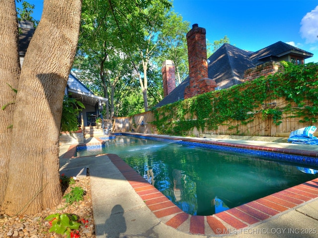 8918 S Lakewood Ave, Tulsa, OK 74137 - view of swimming pool featuring a fenced backyard and a patio