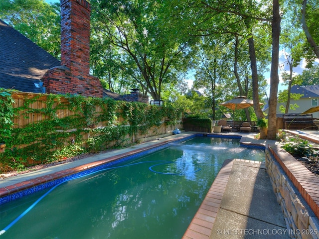 8918 S Lakewood Ave, Tulsa, OK 74137 - view of swimming pool featuring a fenced backyard and a patio area