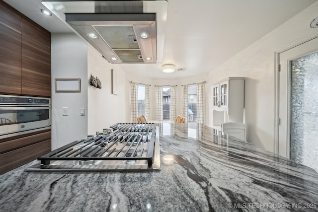 kitchen with stainless steel appliances and stone countertops