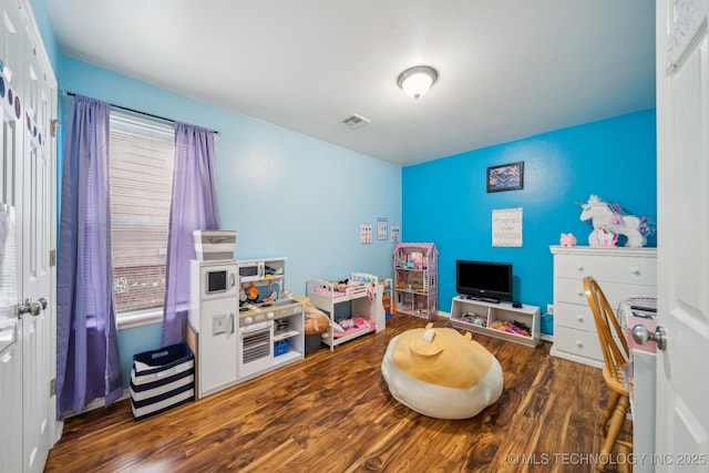 rec room with dark wood-type flooring