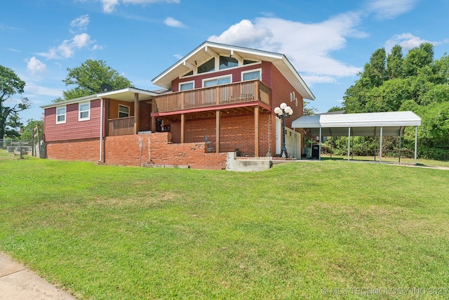 back of house with a carport and a lawn