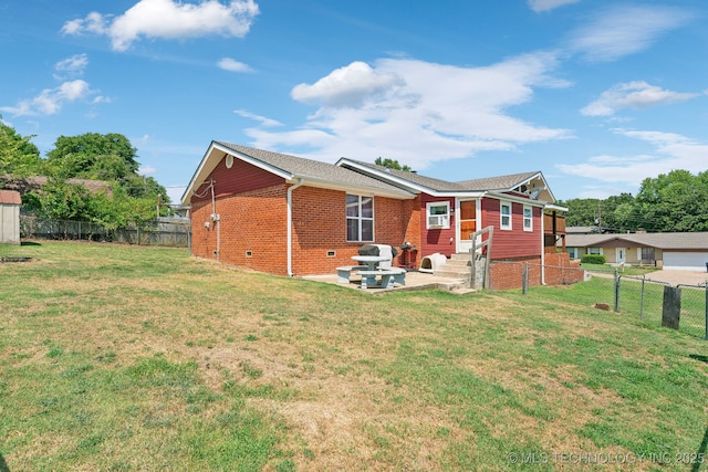 rear view of house with a patio and a yard