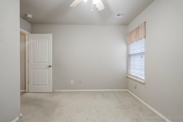 carpeted empty room with ceiling fan