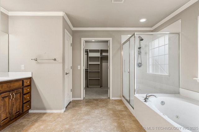 bathroom featuring vanity, tile patterned flooring, crown molding, and plus walk in shower