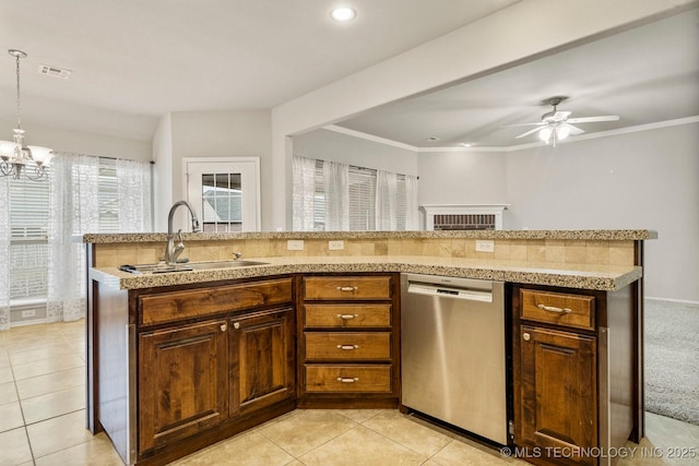 kitchen featuring light tile patterned flooring, pendant lighting, dishwasher, sink, and ornamental molding