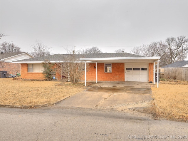 single story home featuring a carport and a garage