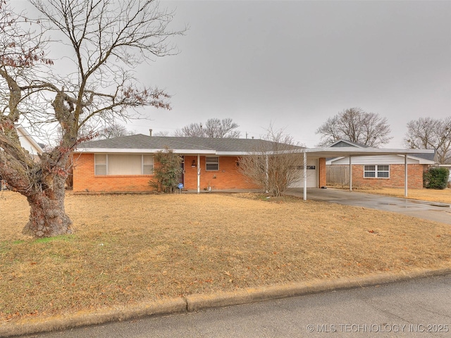 single story home with a front lawn and a carport