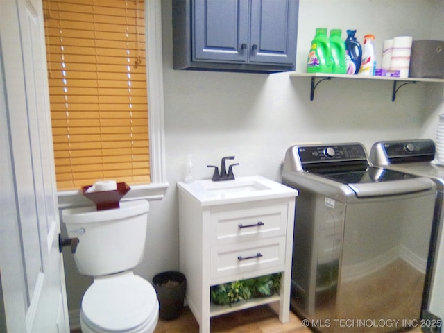 laundry area with washer and clothes dryer and sink