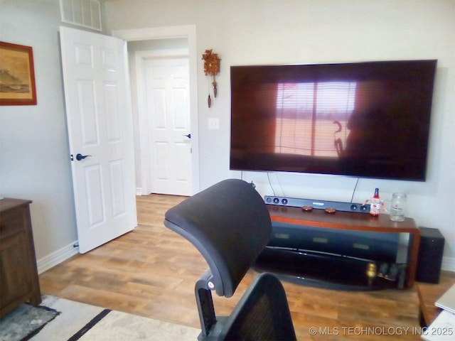 home office with light wood-type flooring