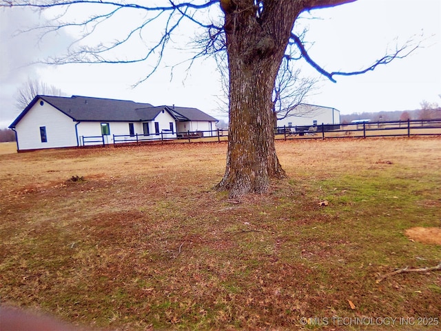 view of yard with a rural view