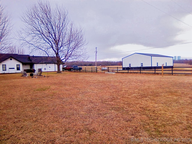 view of yard with a rural view