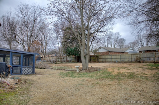 view of yard with a sunroom