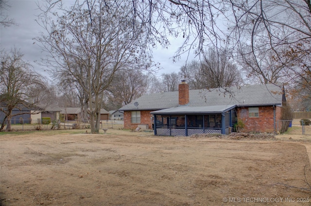 back of property featuring a sunroom