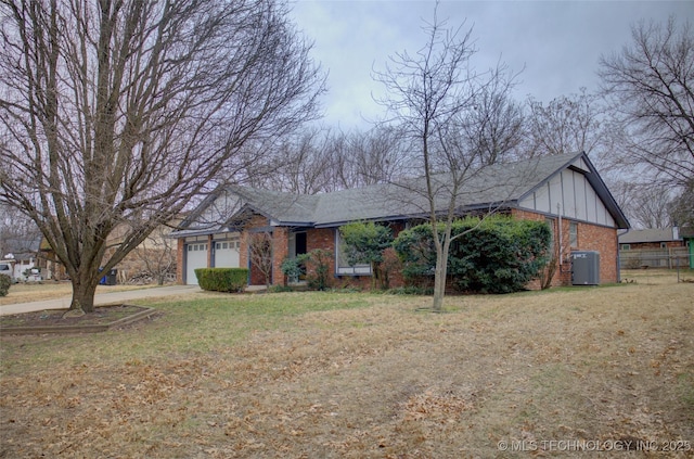 ranch-style home with a garage and a front yard