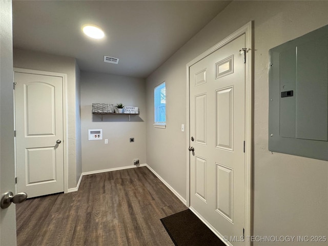 clothes washing area featuring hookup for a washing machine, hookup for an electric dryer, electric panel, and dark hardwood / wood-style flooring