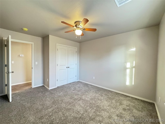 unfurnished bedroom featuring ceiling fan, carpet floors, and a closet