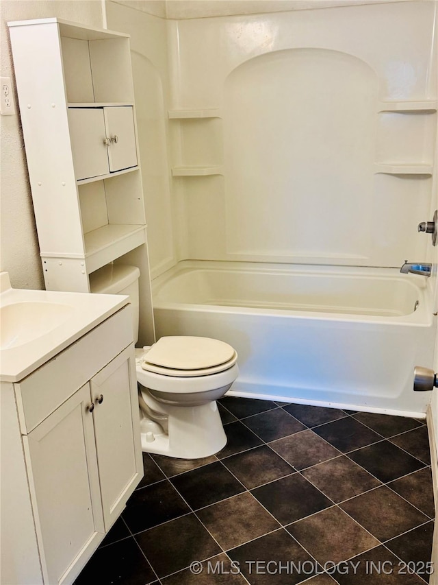 full bathroom featuring tile patterned flooring, vanity, bathing tub / shower combination, and toilet