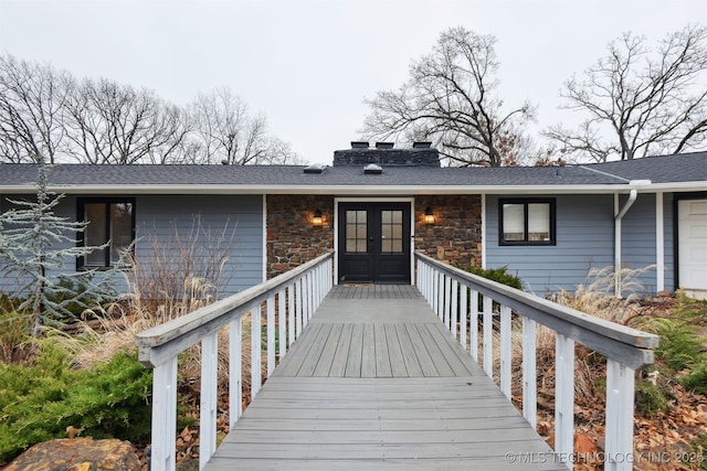 doorway to property with french doors and a deck