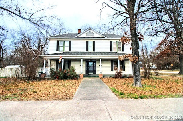 view of property featuring covered porch