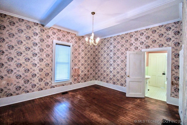 unfurnished room featuring beamed ceiling, ornamental molding, dark wood-type flooring, and a notable chandelier