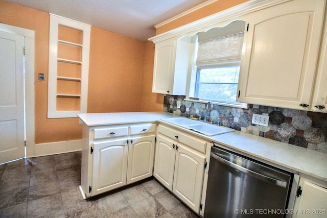 kitchen featuring sink, stainless steel dishwasher, decorative backsplash, and kitchen peninsula