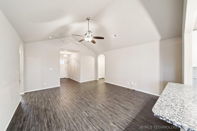 unfurnished living room featuring ceiling fan, lofted ceiling, and dark hardwood / wood-style flooring