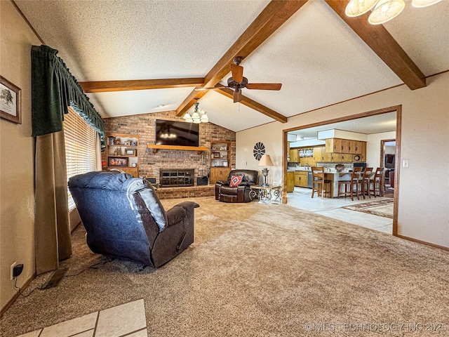 carpeted living room featuring lofted ceiling with beams, ceiling fan, a fireplace, and a textured ceiling