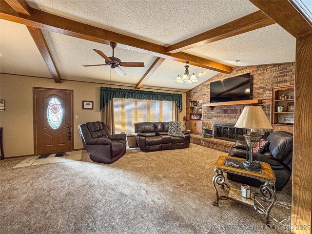 living room with ceiling fan, carpet floors, lofted ceiling with beams, a textured ceiling, and a brick fireplace