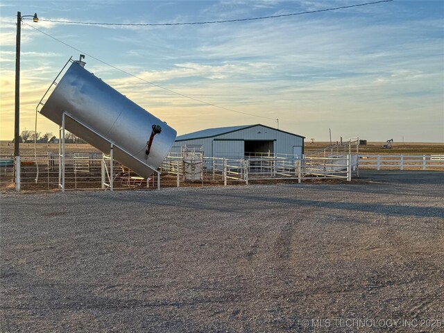 view of stable featuring a rural view