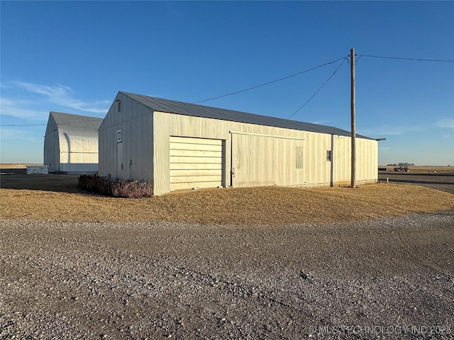 view of outbuilding featuring a garage