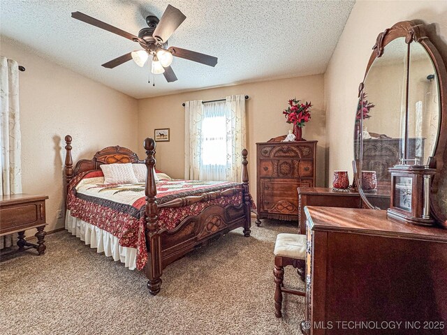 bedroom featuring ceiling fan, carpet flooring, and a textured ceiling